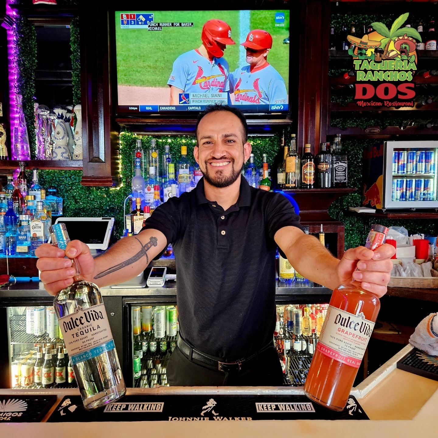 Bartender crafting cocktails at a festive Mexican bar in downtown Buffalo, NY.