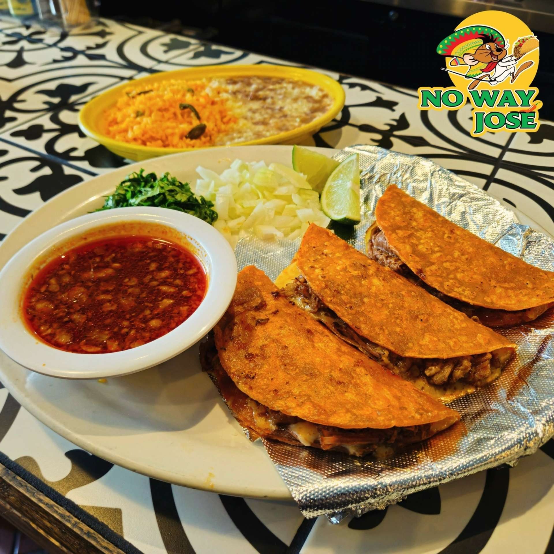 birria tacos with rice, beans, and consome in elmwood village, buffalo, new york