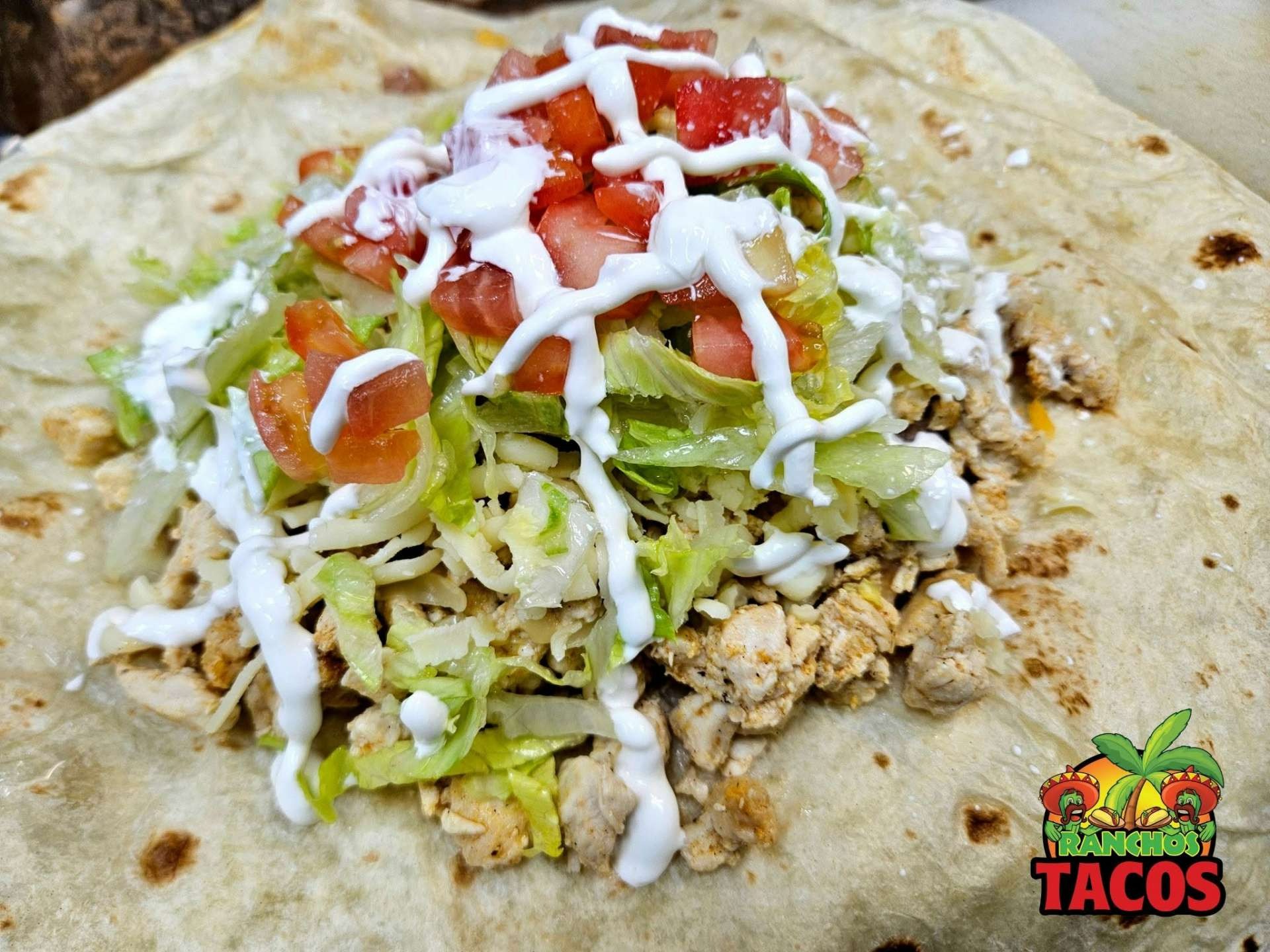 building a burrito at ranchos tacos amherst ny