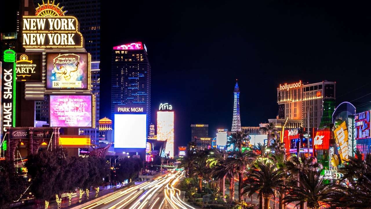 Vibrant Las Vegas strip with neon lights and iconic landmarks.