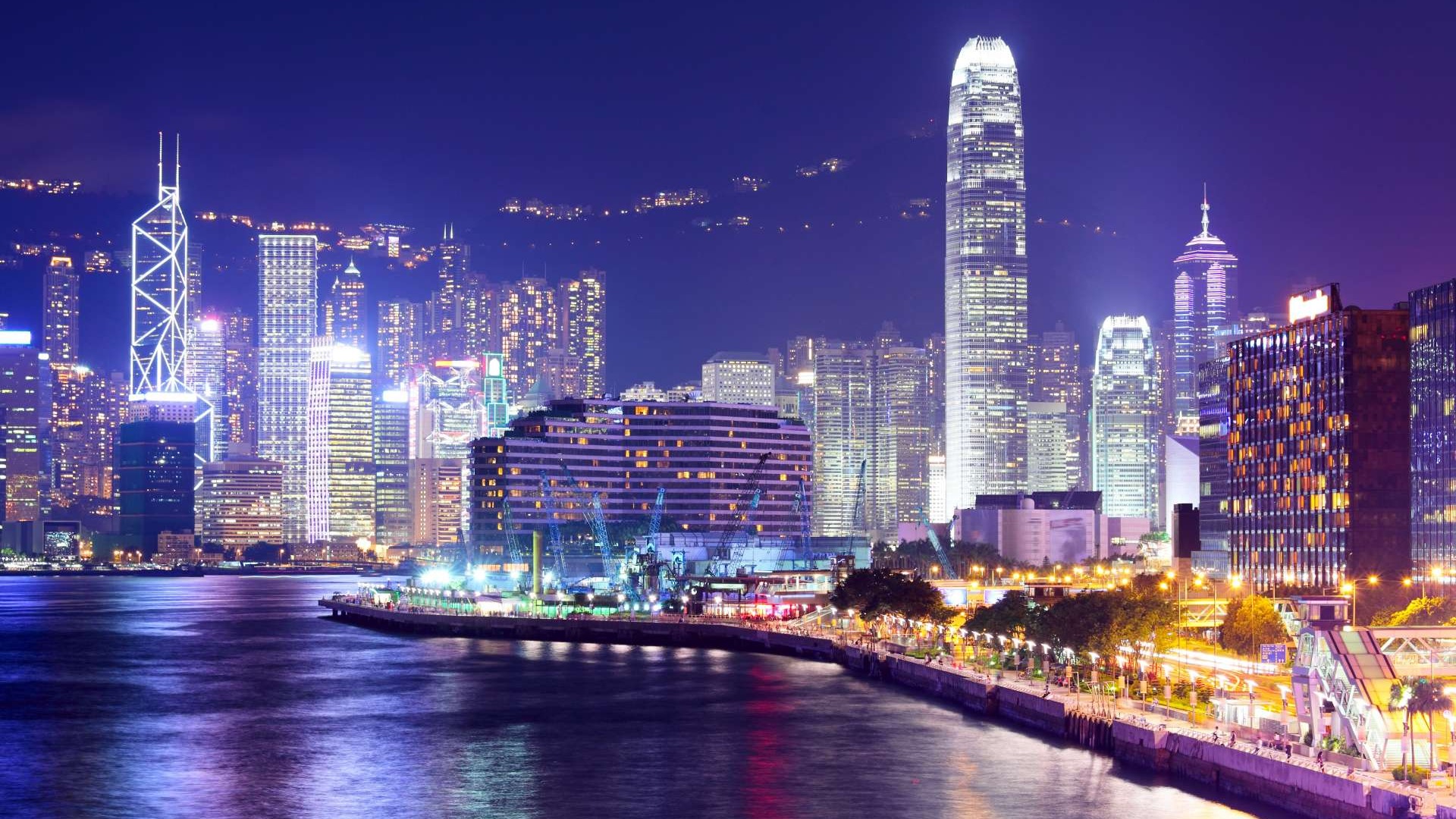 fun travel guide, humorous, suggesting quirky destinations, photorealistic, lively streets of Tokyo at night, highly detailed, animated neon signs, high dynamic range, neon colors, nighttime street lights, shot with a 50mm lens.