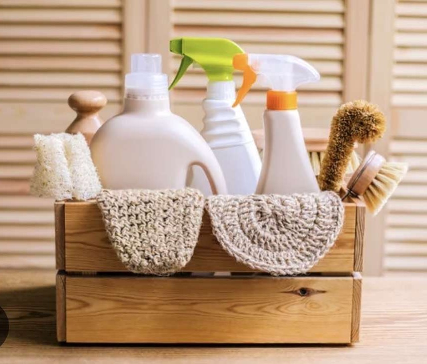cleaning supplies in a wooden box showing natural products