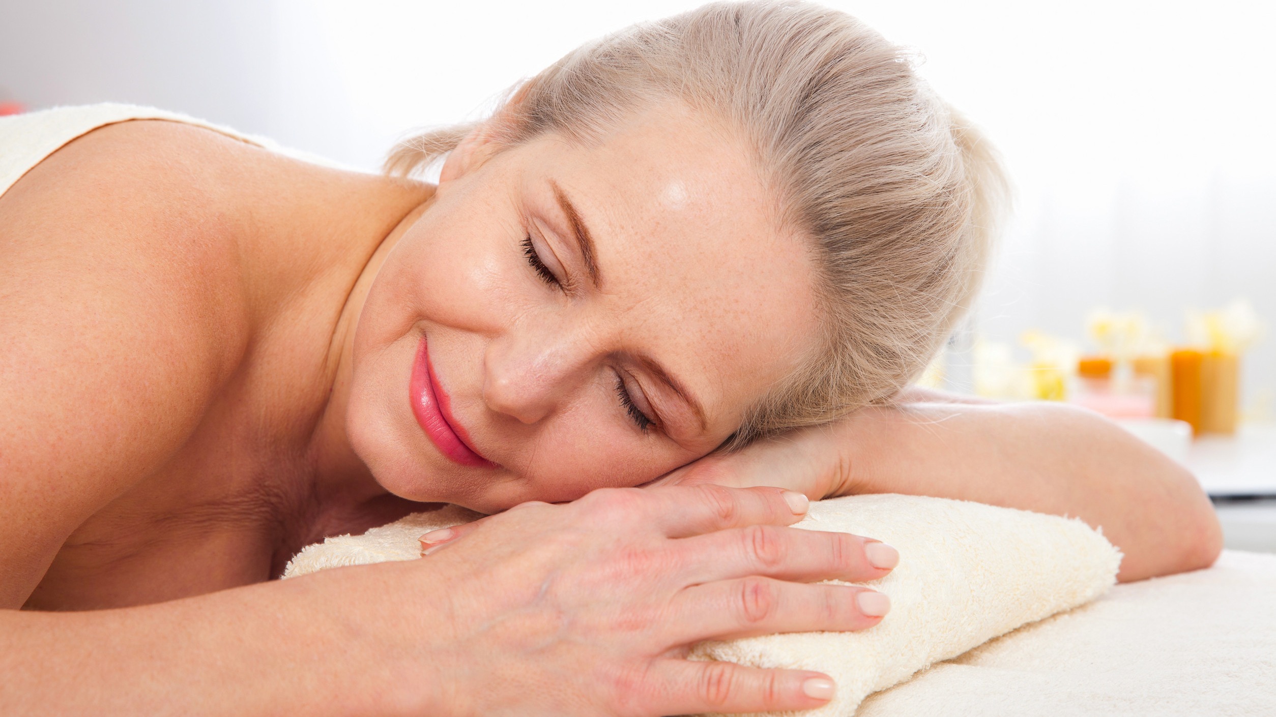 Serene massage spa scene with a woman on a massage table and 'Massage Power' text.