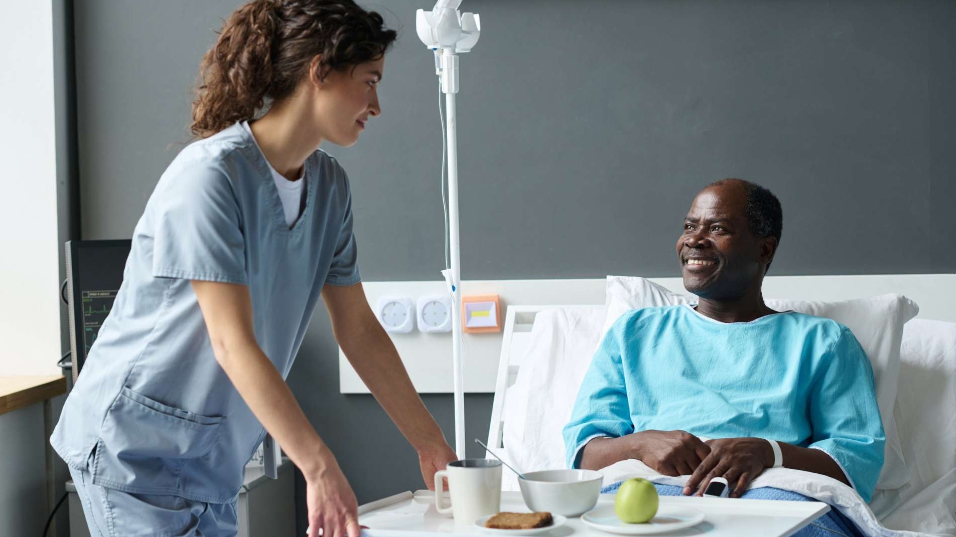 Hopeful young adult man, TJ, recovering in a comfortable hospital bed, cared for by a friend, bright hospital room, warmth and reassurance.