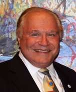 introspective Jeffery portrait, mild smile, sketching ideas, photorealistic, in a bustling urban park with diverse crowd, highly detailed, children playing in the background, 28mm lens, vivid blue sky, diffused daylight, shot with a Sony Distagon T* FE 35mm f/1.4 ZA lens