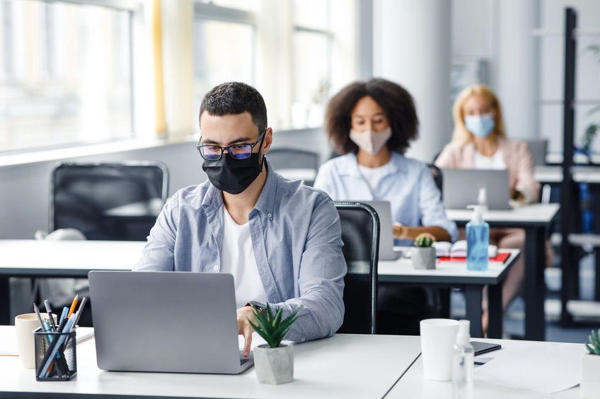 young team wearing mask in the workplace