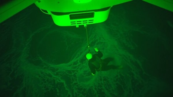 Aerial view of night rescue operation for missing surfer in Puerto Rico.