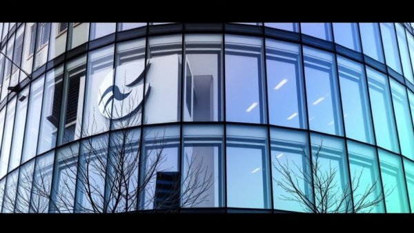 Google headquarters with logo and gradient overlay, architectural design.