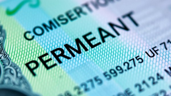 Close-up of a green card representing Trump administration green card reexamination.