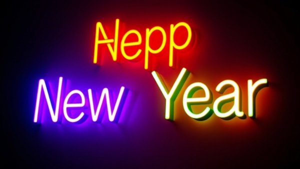 Vibrant neon-style New Year sign, glowing brightly in the dark.