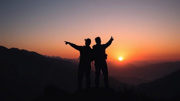 Silhouettes of hikers at sunset capturing sustainable tourism in Finale Ligure.