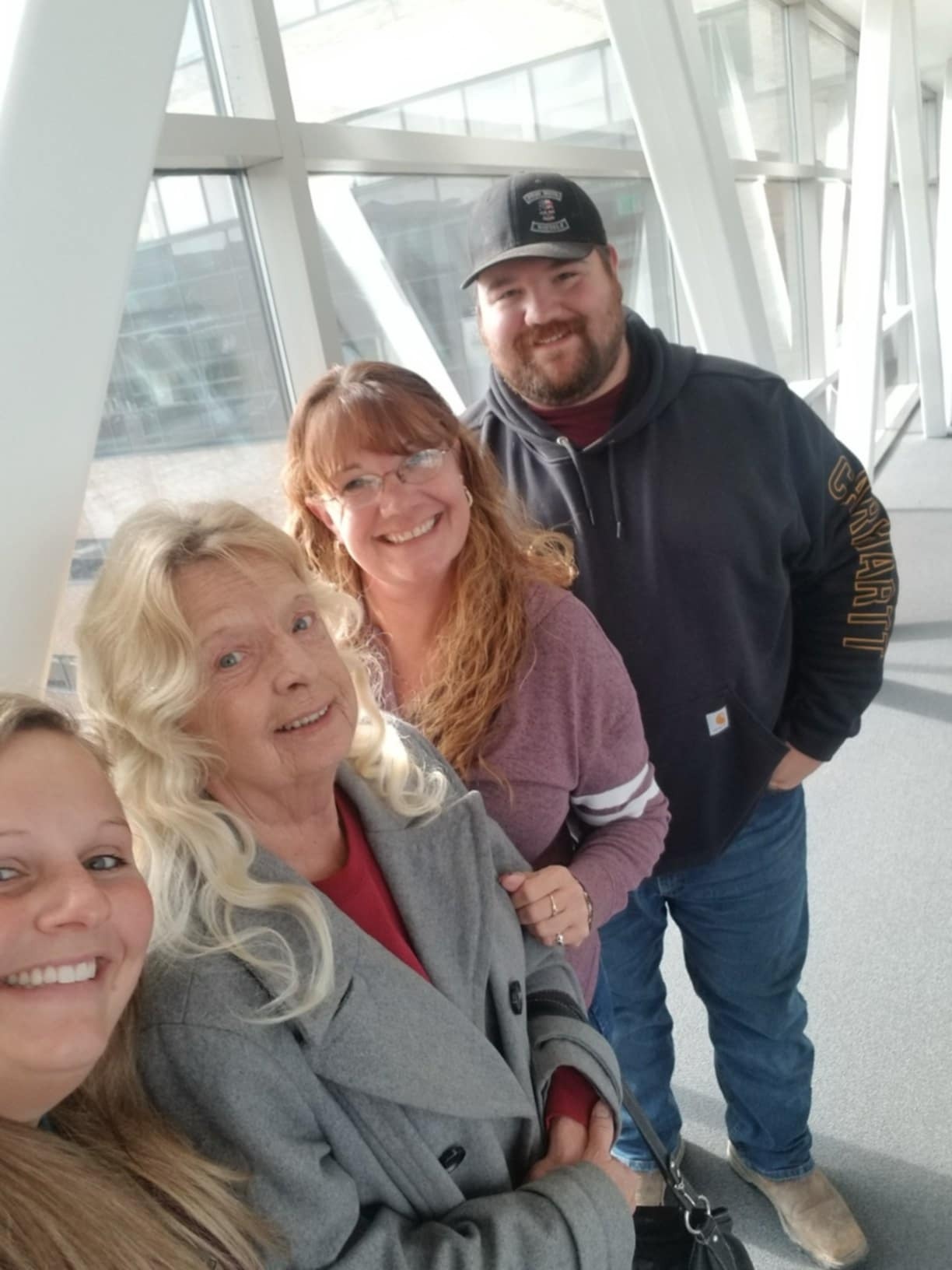 ceremonial family setting, respectful, observing rituals, photorealistic, in a grand banquet hall with chandeliers, highly detailed, glasses clinking in the distance, panoramic view, deep blue attire, spotlight illumination, shot with a tilt-shift lens.