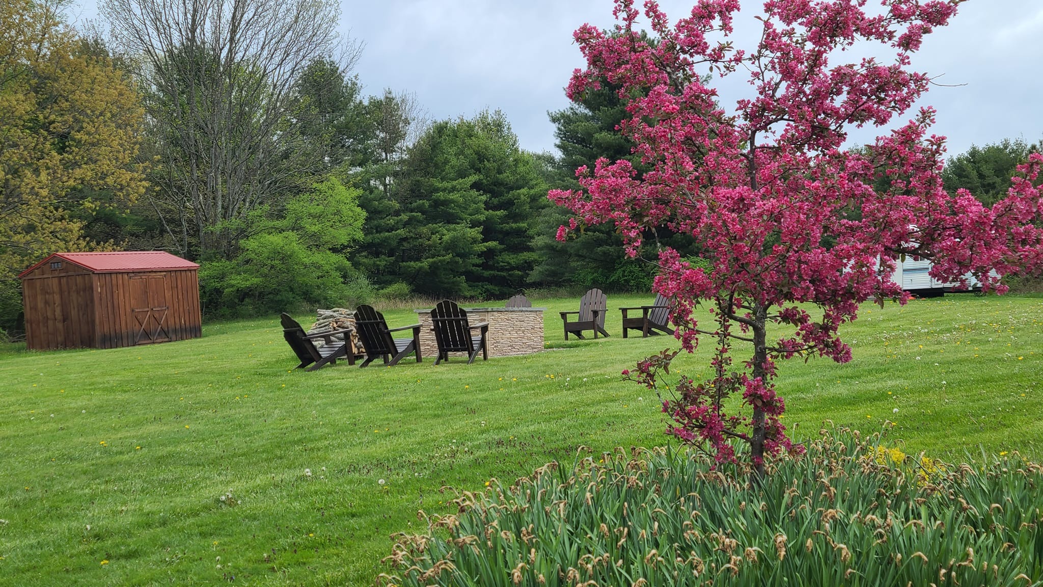 rich heritage legacy, proud expression, exhibiting cultural attire, photorealistic, within a vibrant village market filled with textiles, highly detailed, people bustling in the background, shot in 4K, vibrant primary colors, golden hour lighting, shot with a 24-70mm lens.