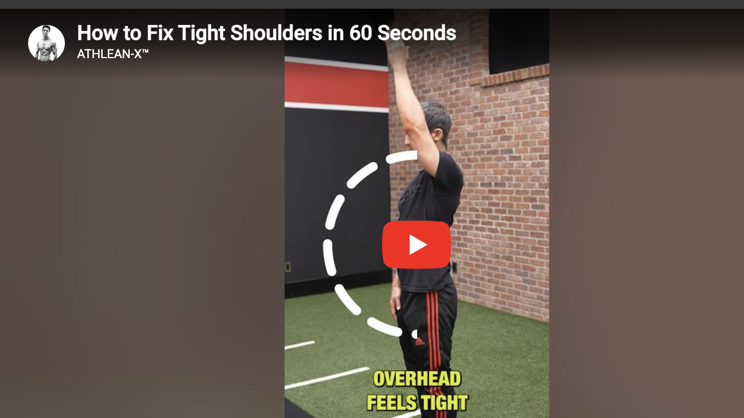 Person demonstrates stretch to fix tight shoulders in 60 seconds.