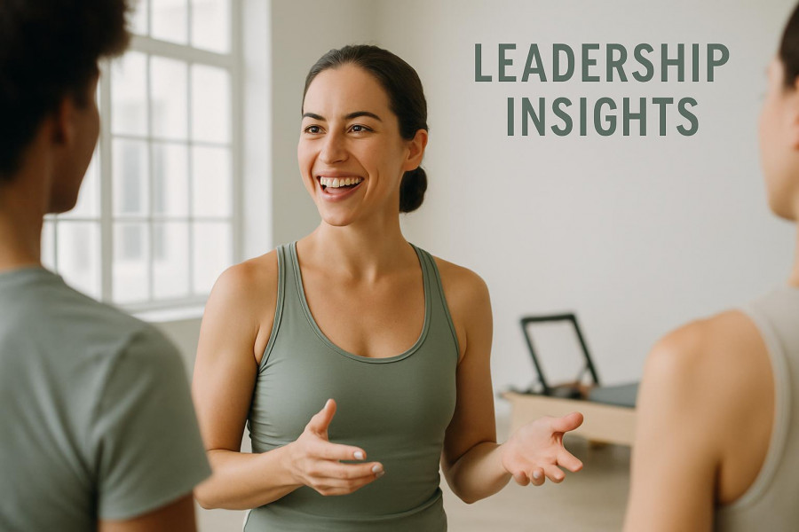Confident Pilates studio owner sharing leadership strategies for fitness studio growth.