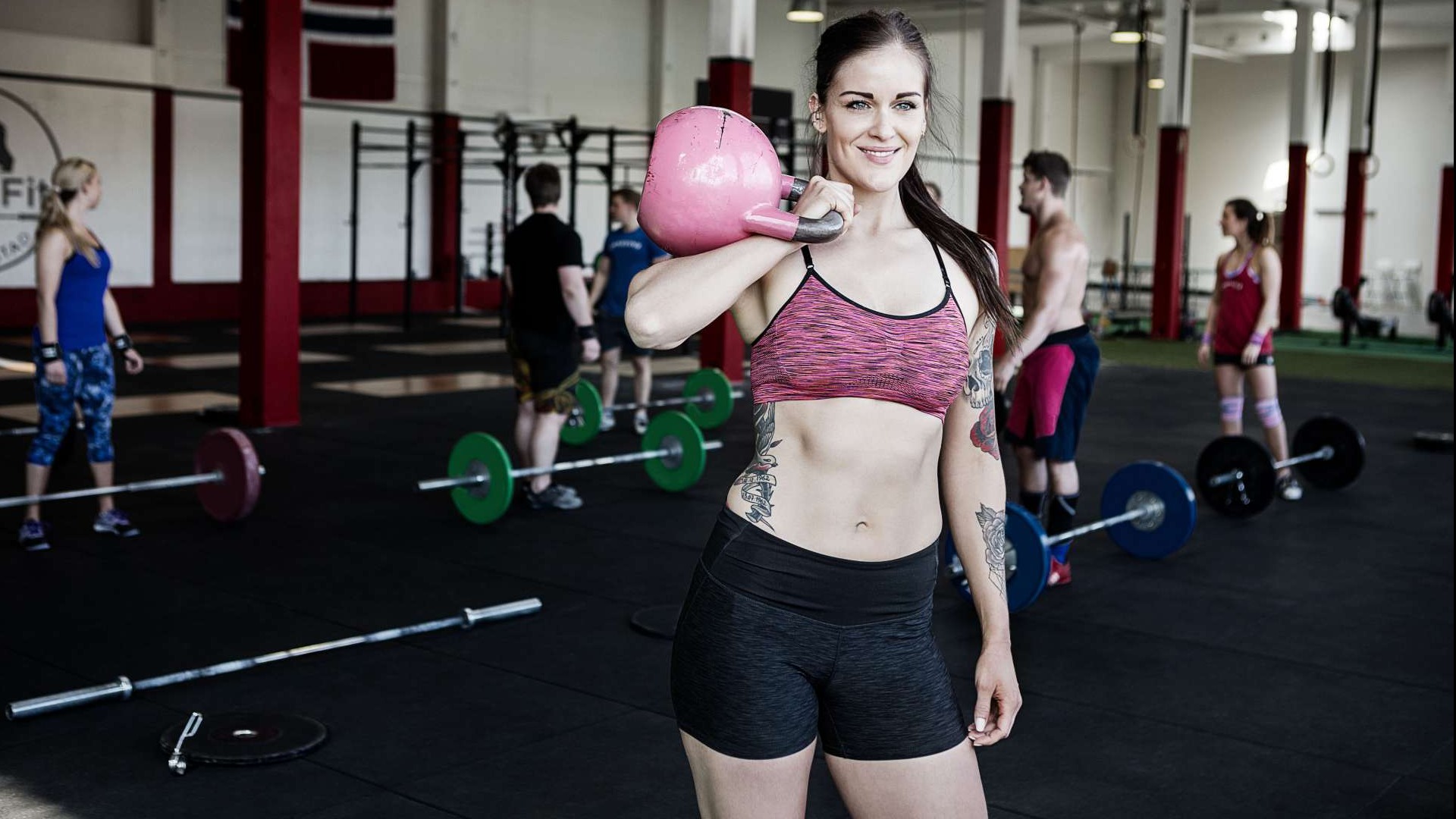 Bright, modern gym interior with happy, diverse gym members smiling and engaging, gym equipment in background, reactivate cancelled gym members