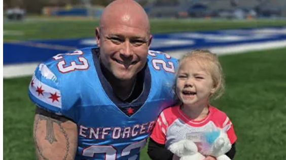Football player and young girl on the field, fitness foundation.