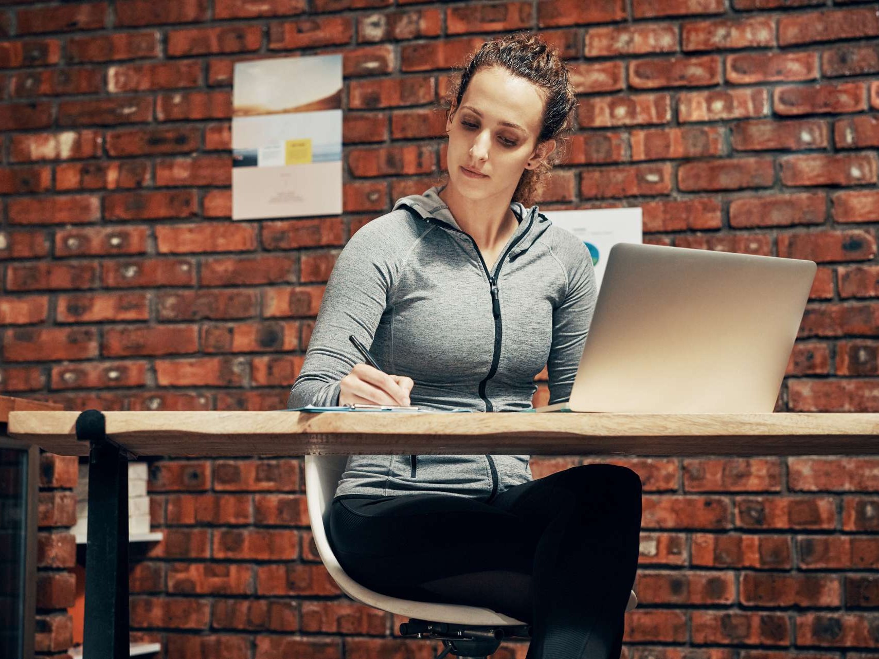 Frustrated fitness gym owner in a quiet studio with unused equipment, empty machines, and subtle signs of inactivity. Ideal representation for articles about fitness business revenue challenges.