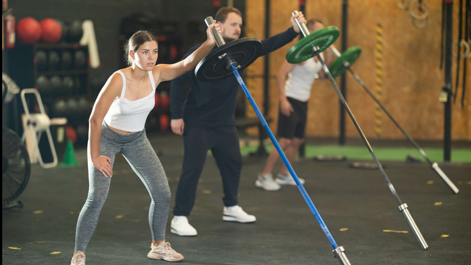 Athlete showcasing Landmine Training with a barbell, embodying strength and focus.