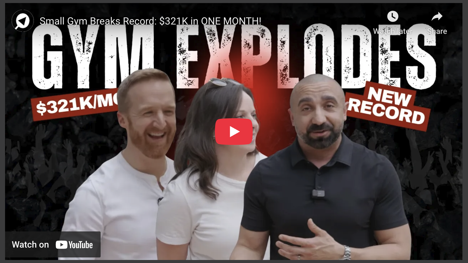 Small gym breaks record as group celebrates with joyful expressions.