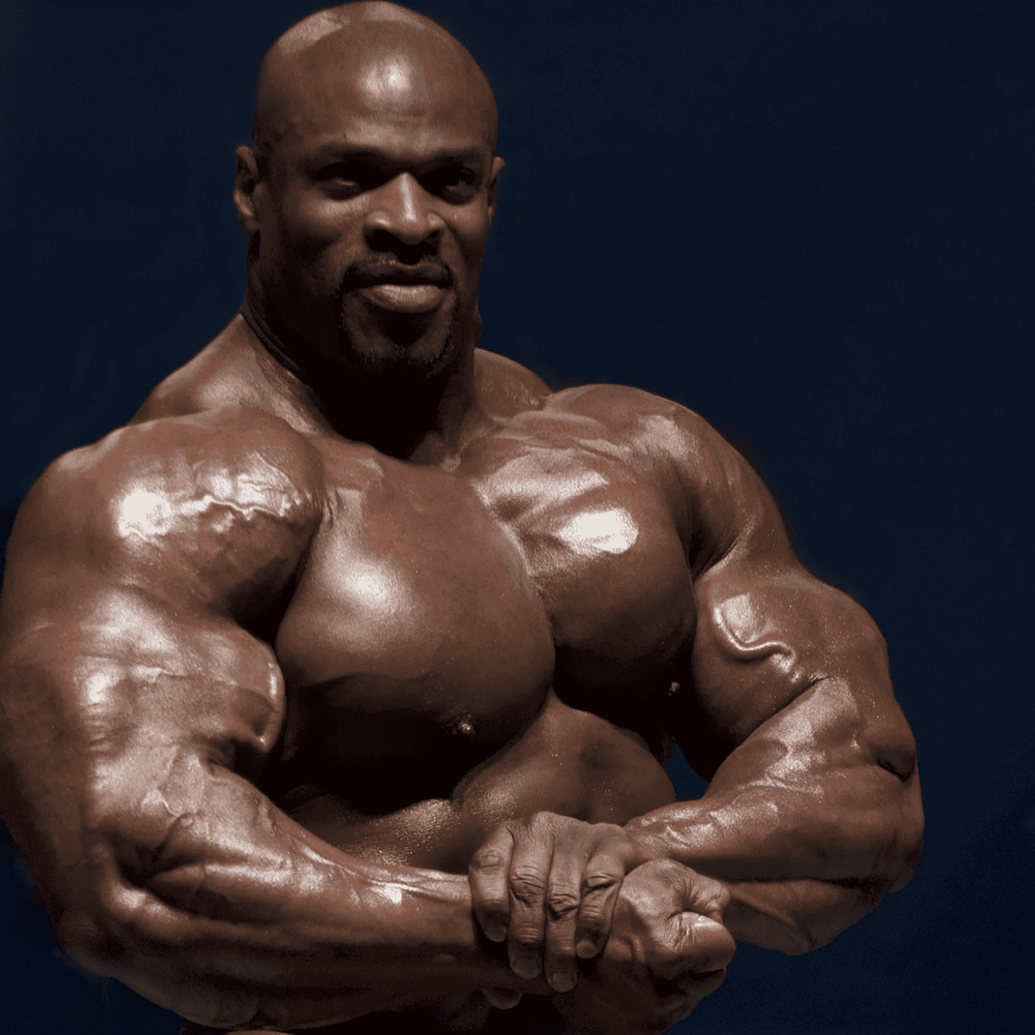 Ronnie Coleman trains Blessing Awodibu in a gym setting.