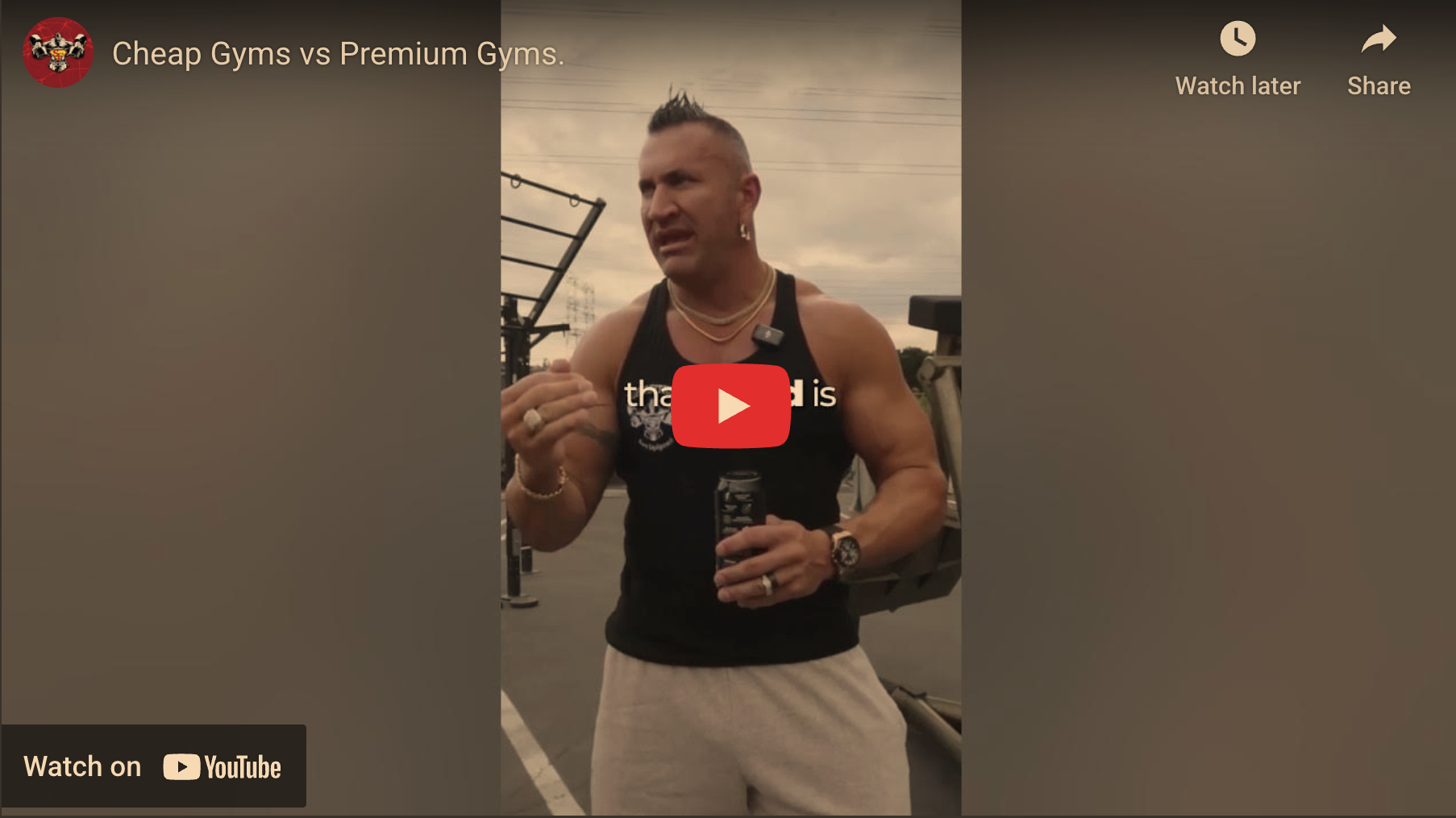 Muscular man discussing fitness outdoors at a gym