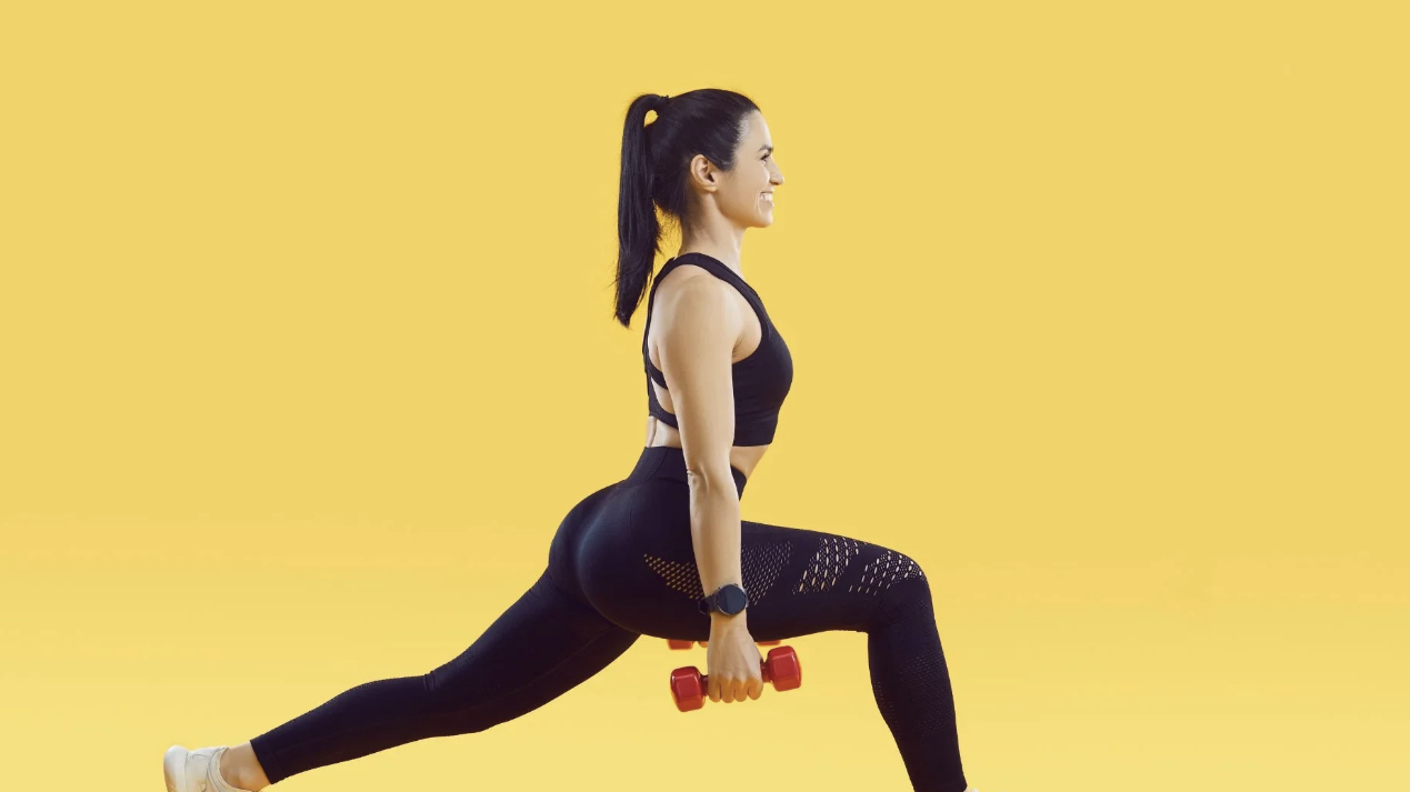 Effective butt exercises: woman lunging outdoors.