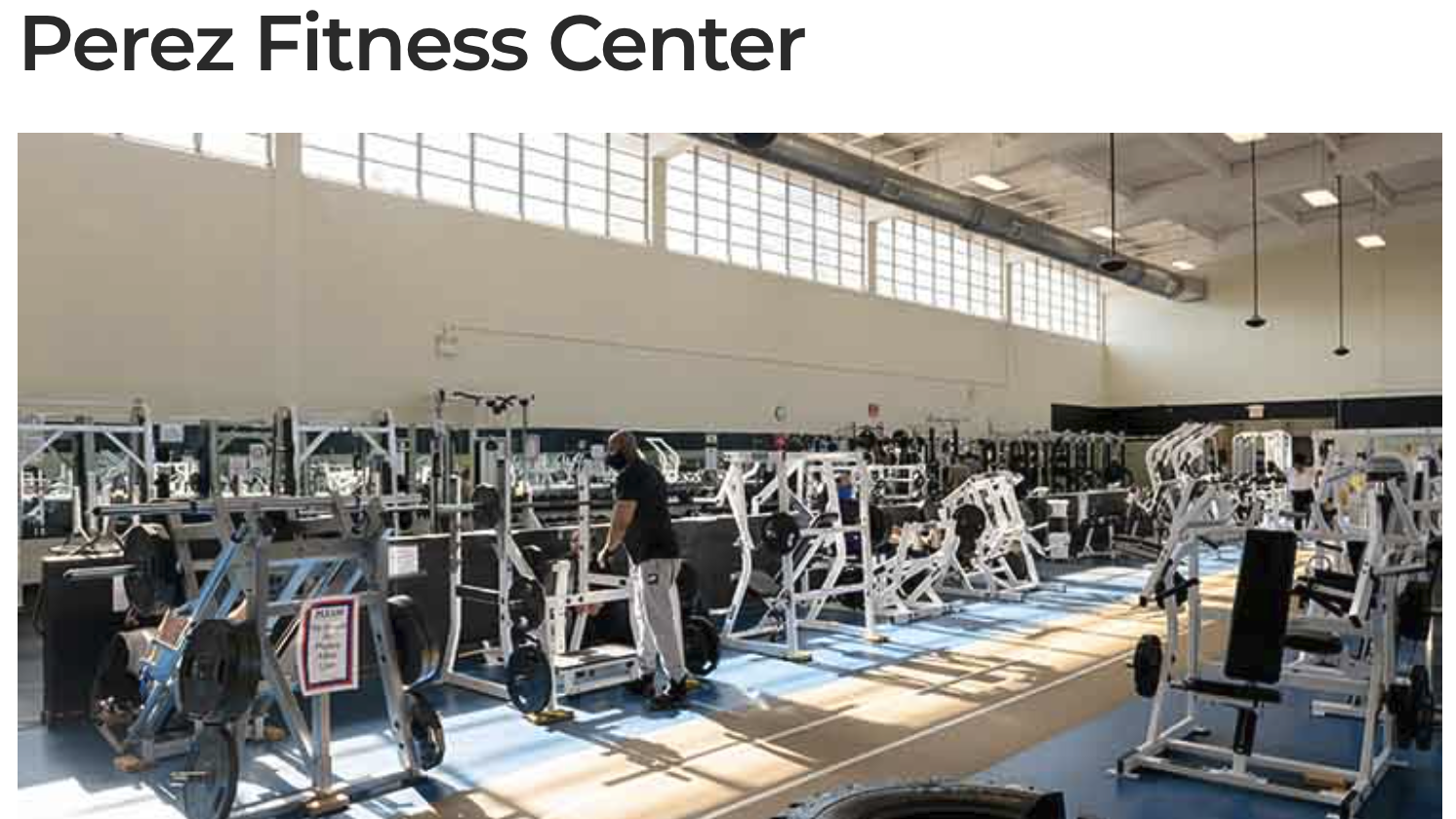 Interior of Perez Fitness Center gym with modern equipment and spacious layout.