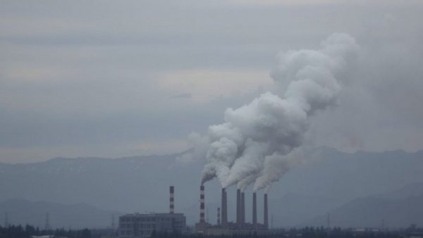 Industrial pollution illustrating climate health risks in a cityscape.