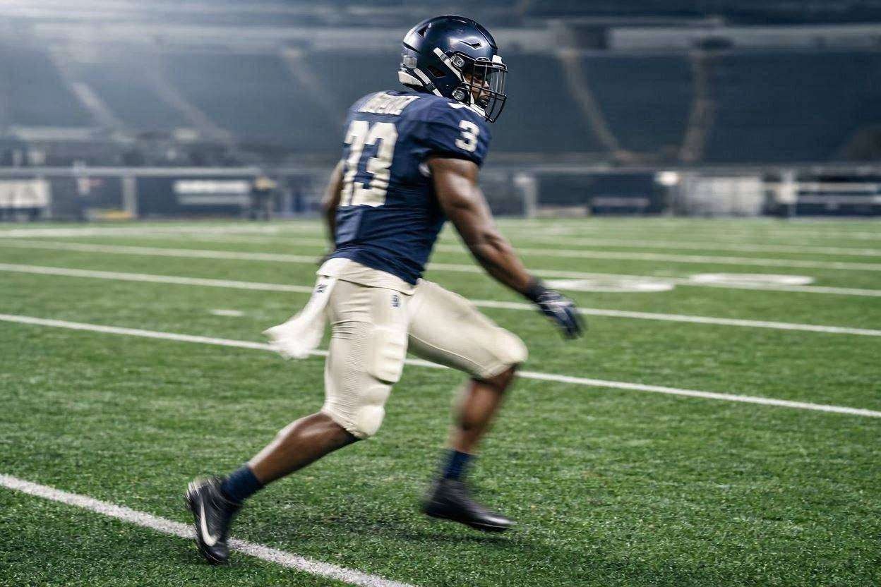 Defensive back in backpedal stance, photorealistic action on turf field.