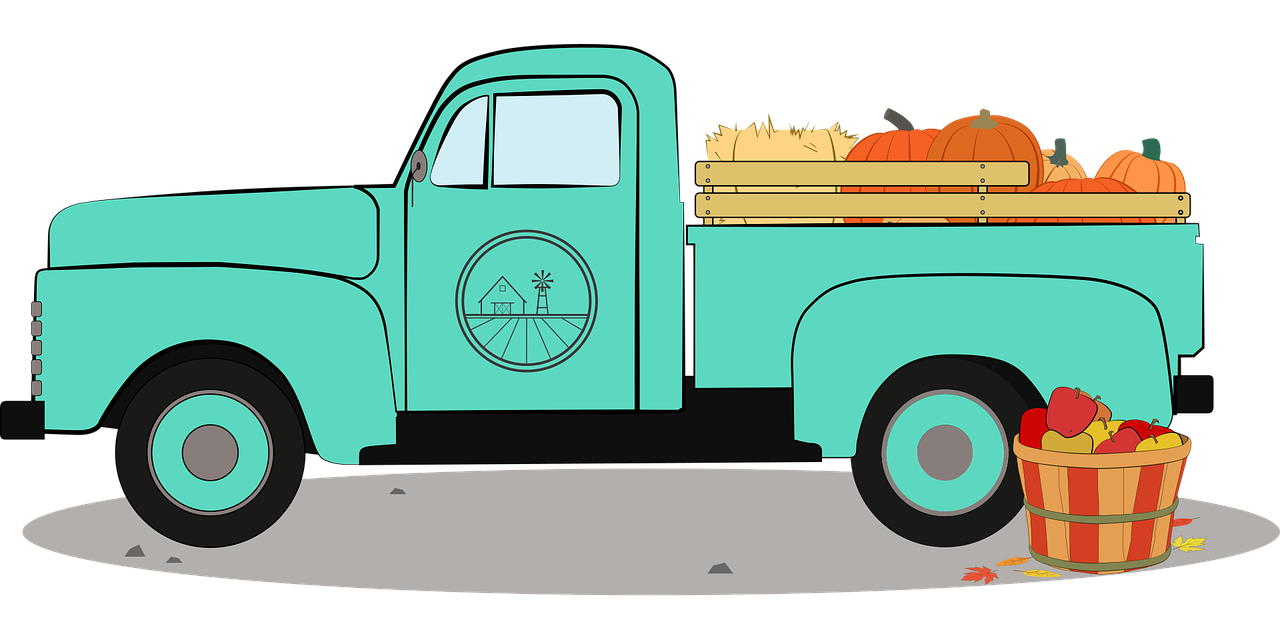 Blue Farm truck with hay and pumpkins