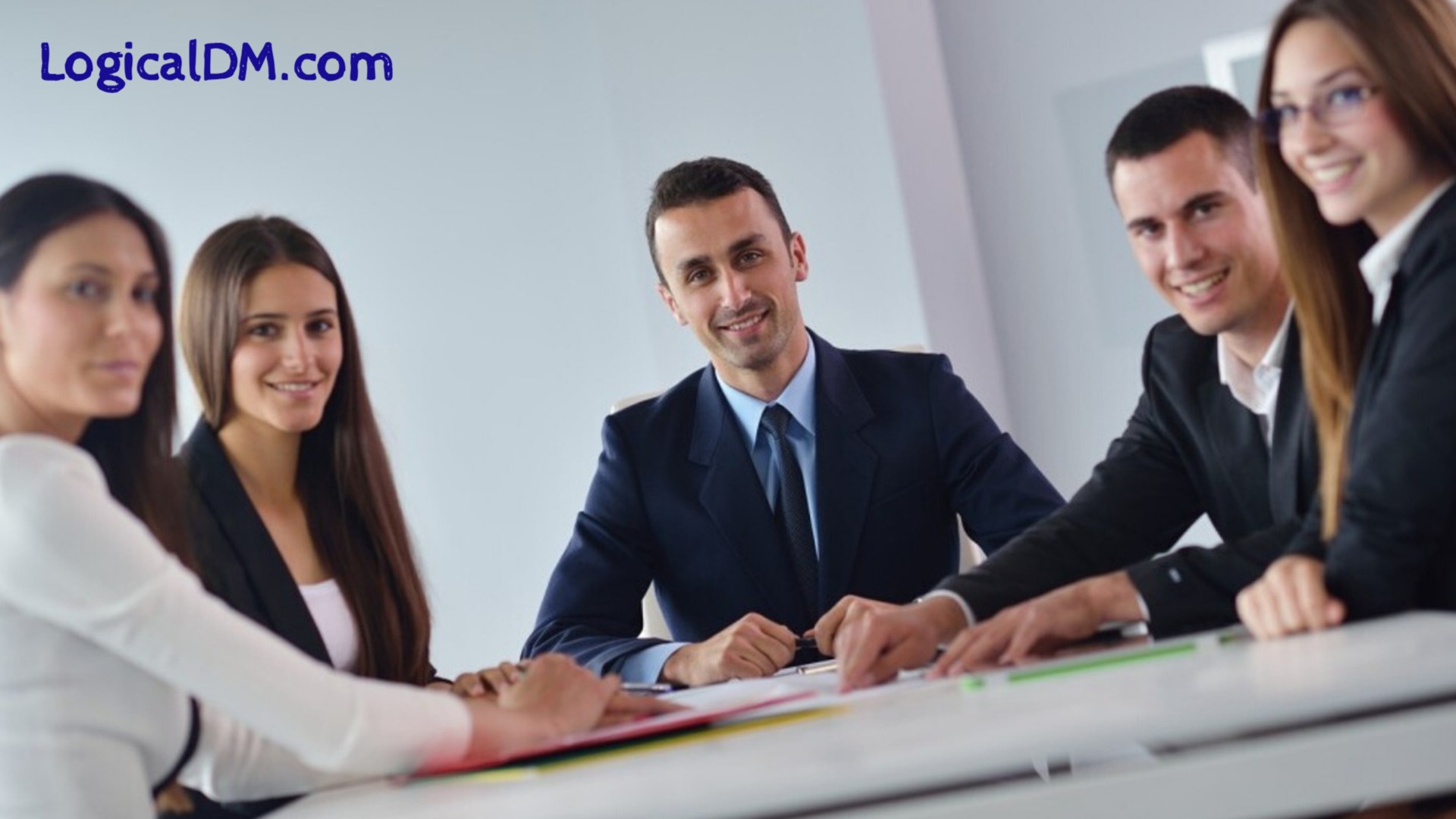 5 business person team sitting at table