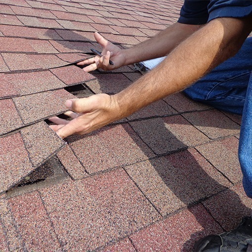 Roofing Contractor in Macomb County looking at a repair