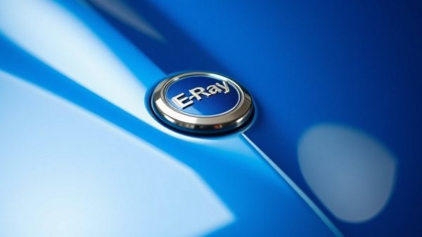 Close-up of Chevrolet Corvette E-Ray badge on blue car body.