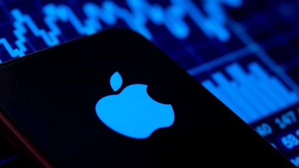 Smartphone with Apple logo in front of stock graph, Apple $4 trillion valuation.