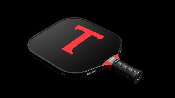 Sleek Tesla pickleball paddle with red and gray design against black background.