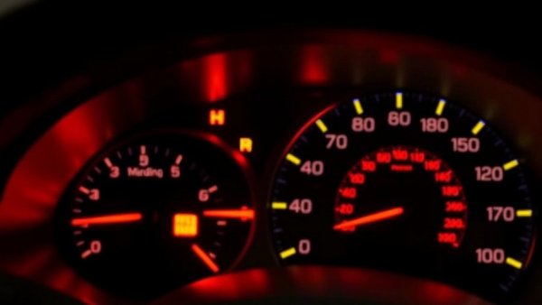 Car dashboard displaying warning lights meaning in winter conditions.