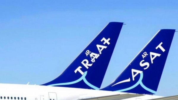 Air Transat airplane tails align, showcasing blue and white logo.