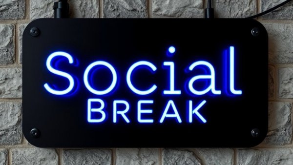 Modern 'Social Break' sign with blue neon letters on stone surface.