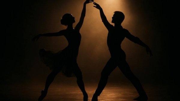 Silhouetted dancers performing 'Dancing in the Dark.'