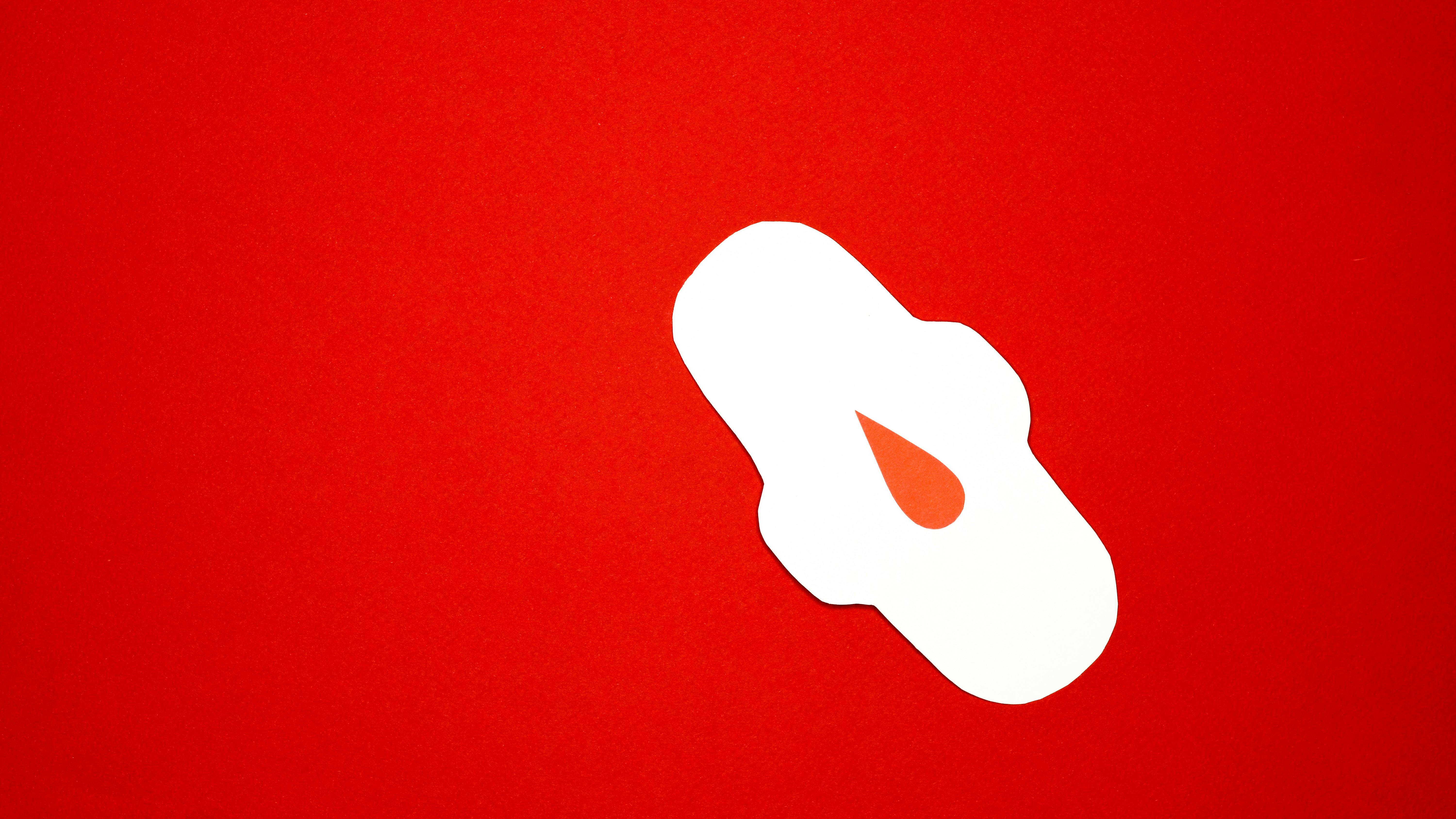 Doctor discussing the use of panty liners in an office setting.