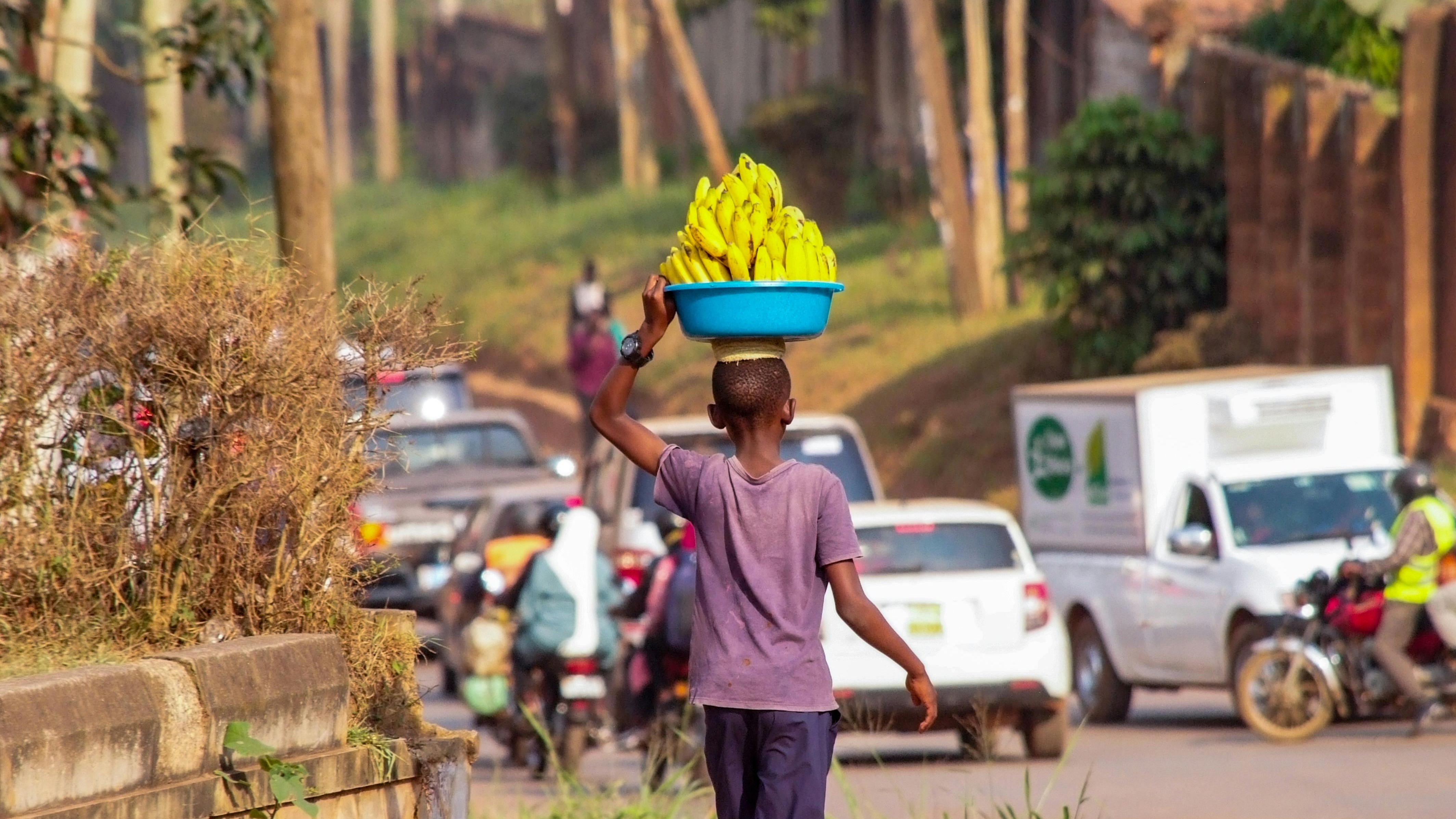 Exercise Uganda: Busy professionals in Kampala city traffic experiencing back pain, stressful commutes, and sedentary habits. Photorealistic, diverse, urban scene.