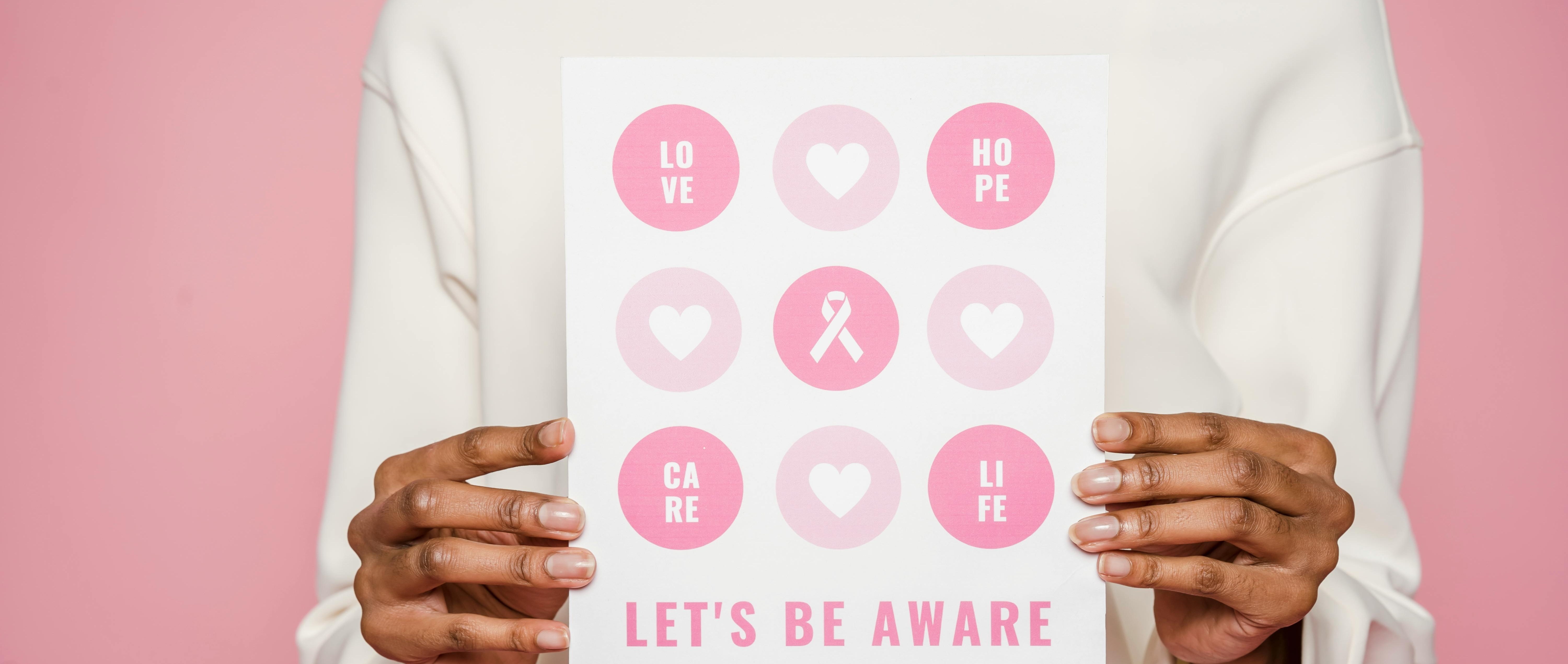 Smiling woman waving before a cervical cancer screening appointment.