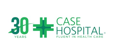 Smiling African woman in green scrubs at Case Hospital, showcasing healthcare in Uganda.