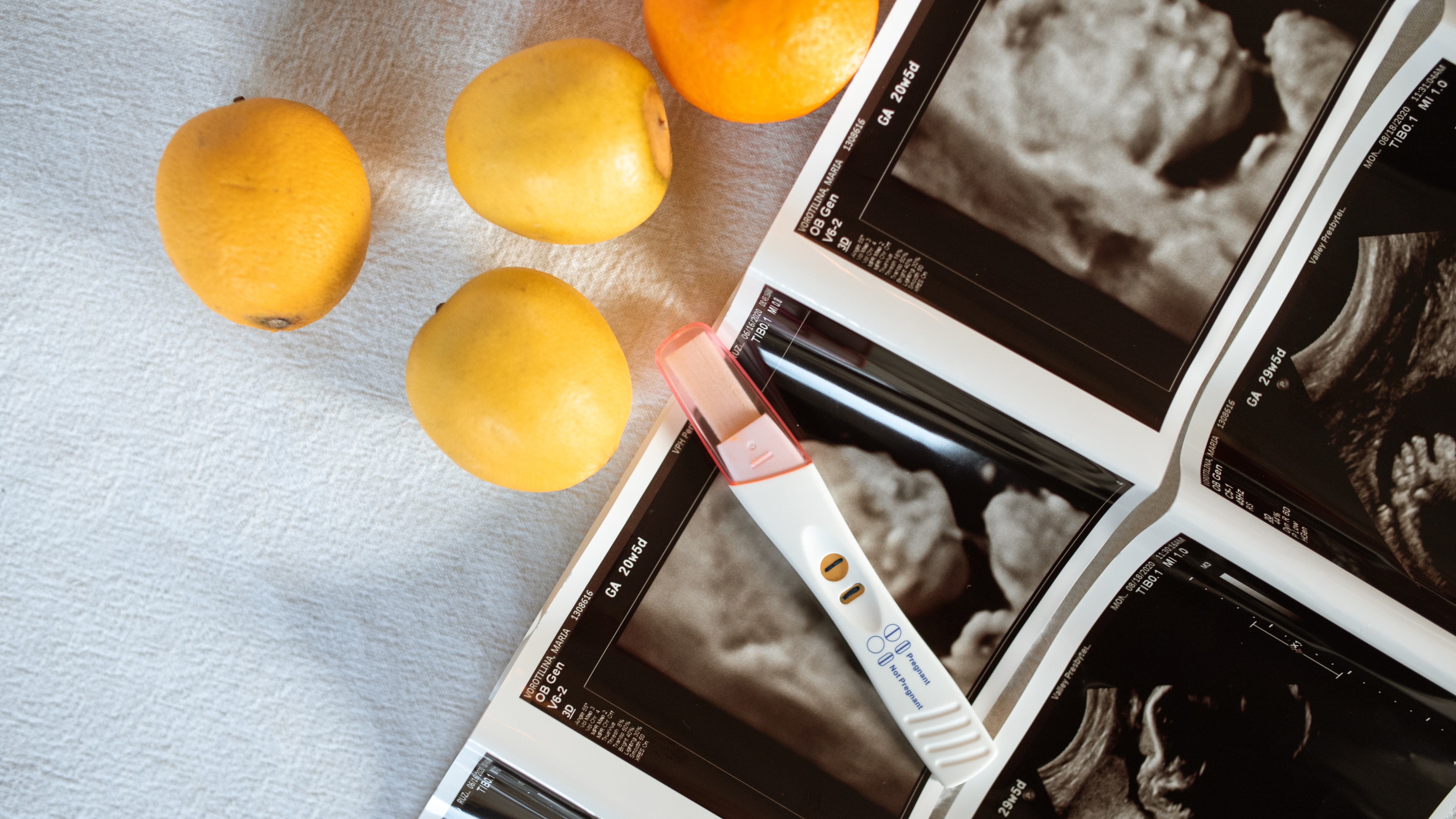 Pregnant woman eating salad with essential pregnancy tips.