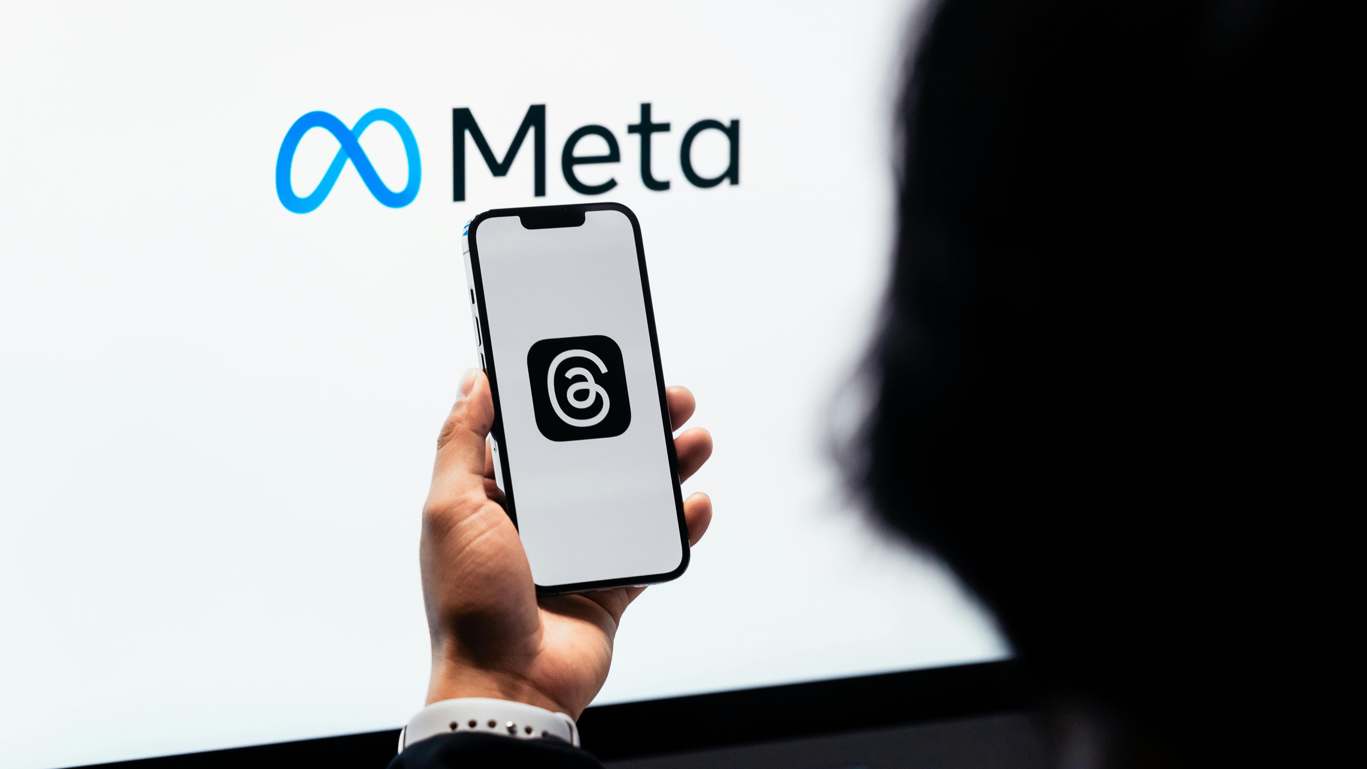 Business logo with blue circle and text.