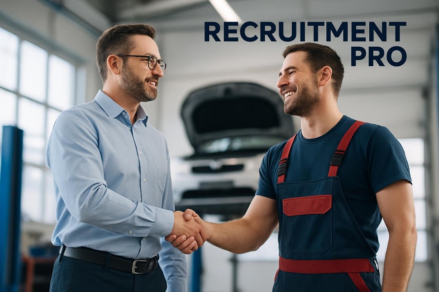 Confident auto repair manager and smiling mechanic discuss recruitment strategies in bright garage.
