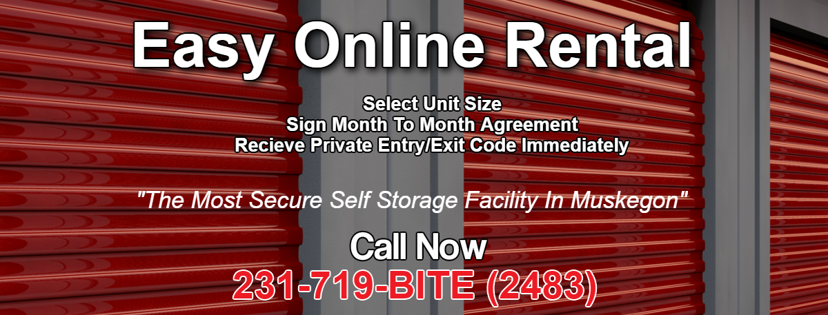 Self storage facility exterior with dark red roll-up doors and tan trim on a sunny day.