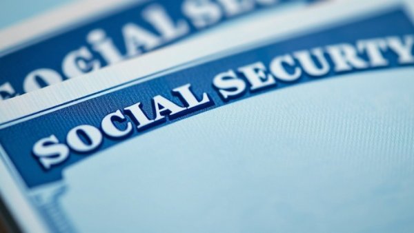 Close-up of Social Security cards highlighting benefits for 2026.