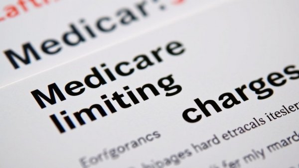 Medicare health insurance card close-up with text on limitations.